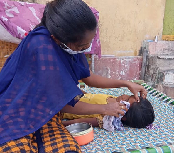 Lady taking care of sick child